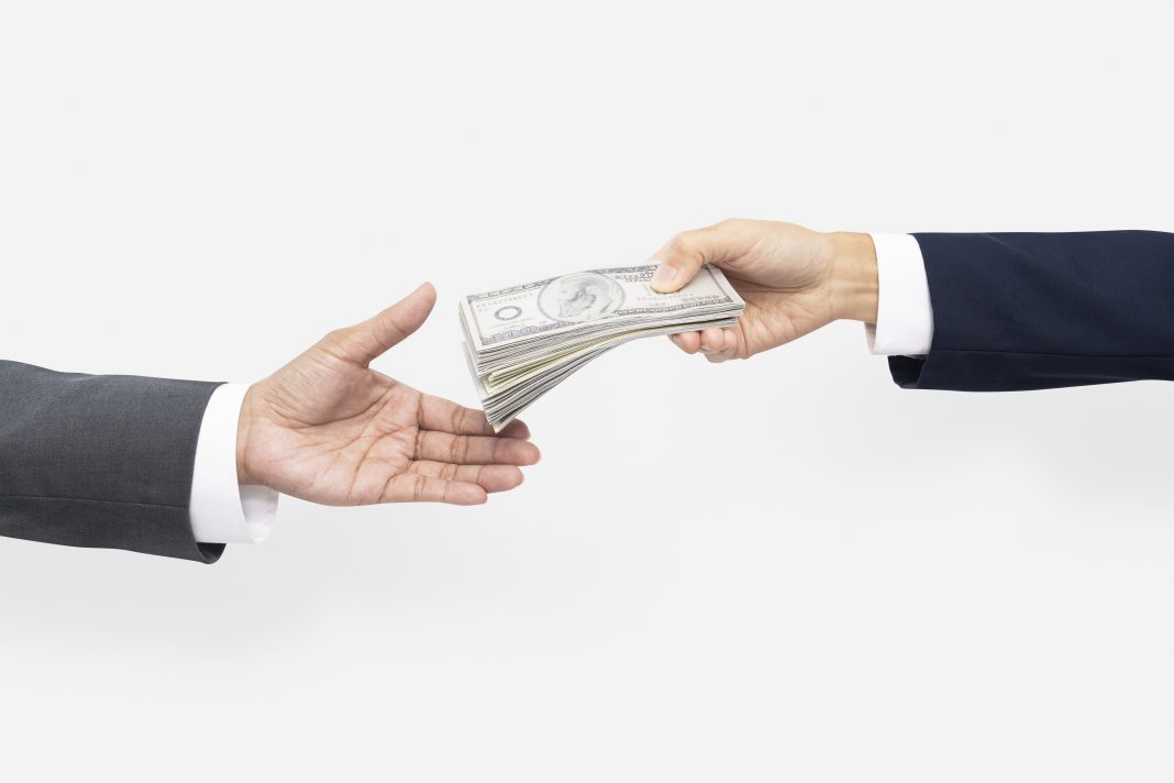 New EPFO Rs 15,000 Wage Ceiling Rule Frozen – What It Means For Your Take-Home Salary From July 1 Indian employee checking salary slip and EPFO provident fund details on laptop