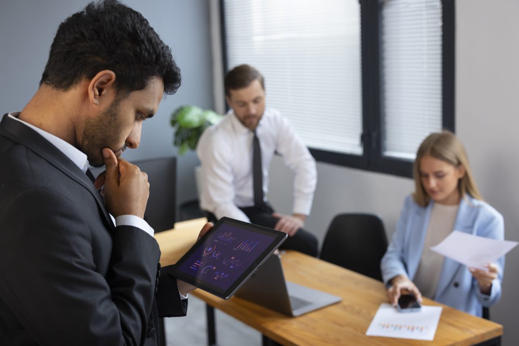 Tech Layoffs In 2026 Already Cross 2025 Levels: Why India Is The Second-Worst Hit Software engineer looking at layoff notifications on a laptop with AI and technology icons in the background.
