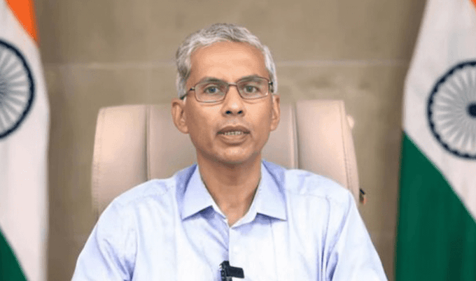 Anurag Jain Named NITI Aayog CEO: What Could Change At India’s Top Policy Think Tank? Senior government official walking through a policy planning office with documents.