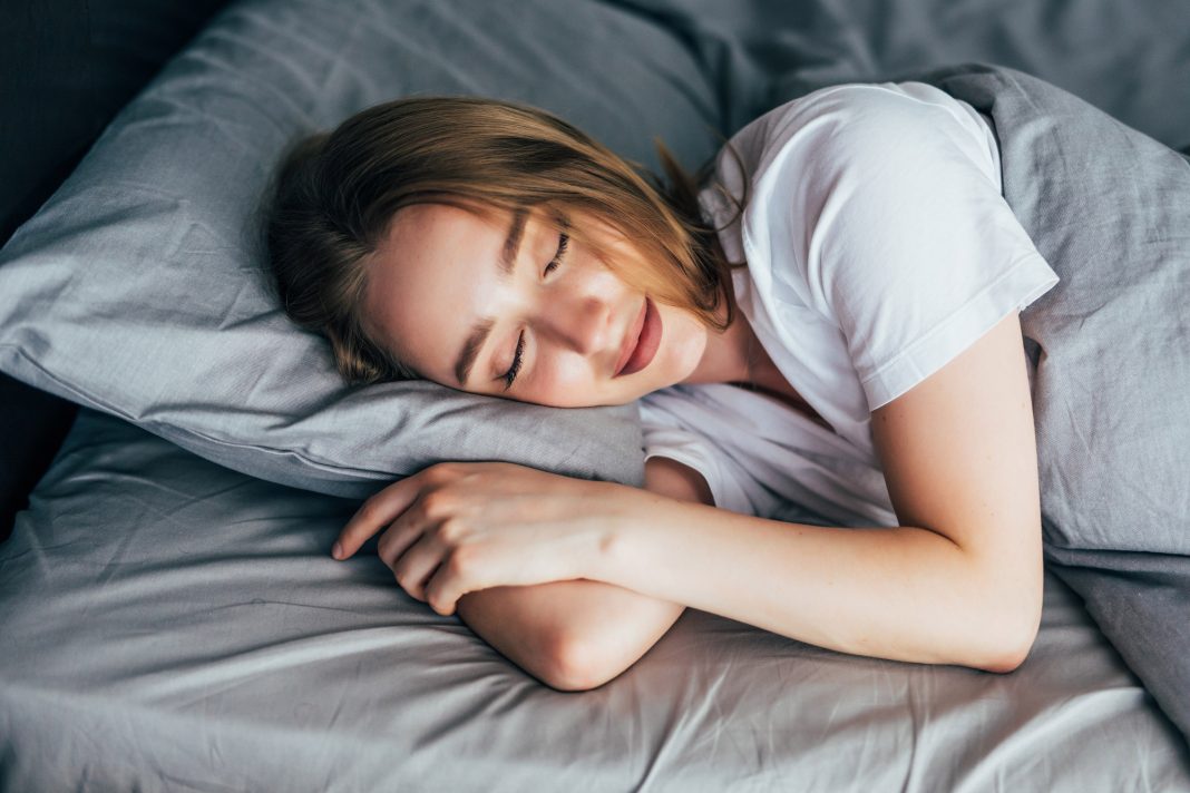 6 Hours vs 8 Hours Of Sleep: What It Really Does To A Woman’s Body Woman resting peacefully showing importance of 8 hours sleep for better health and hormonal balance.