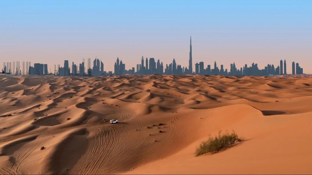 Golden sand dunes with a white off-road vehicle in the foreground, and Dubai’s modern skyline including Burj Khalifa in the distance.